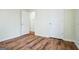 Bright bedroom features lovely wood flooring, white trim, and a neutral paint at 12 Paces Lakes Overlook, Dallas, GA 30157