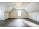Spacious bonus room with ceiling fan, natural light, and neutral paint at 12 Paces Lakes Overlook, Dallas, GA 30157