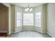Cozy dining area with bay window and modern light fixture at 12 Paces Lakes Overlook, Dallas, GA 30157