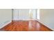 Large living room with wood floors and natural light at 12 Paces Lakes Overlook, Dallas, GA 30157