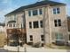 View of a backyard featuring light brick, a deck, and outdoor seating area at 4604 Mossey Dr, Stonecrest, GA 30038