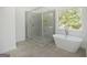 Luxurious bathroom includes a large glass shower and a freestanding soaking tub by the window at 4604 Mossey Dr, Stonecrest, GA 30038