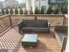 Outdoor deck featuring wicker seating and glass-topped coffee table at 4604 Mossey Dr, Stonecrest, GA 30038