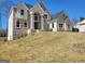 Stunning two-story home with classic brick facade and arched entryway detailing at 4604 Mossey Dr, Stonecrest, GA 30038