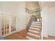 Open foyer featuring hardwood floors, stairs, and a view of the upper level at 4604 Mossey Dr, Stonecrest, GA 30038