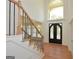 Entryway with hardwood floors, a staircase, and a high ceiling at 4604 Mossey Dr, Stonecrest, GA 30038