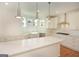 Gourmet kitchen features a large center island, white countertops, and stainless steel appliances at 4604 Mossey Dr, Stonecrest, GA 30038