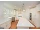 Spacious kitchen boasts a center island, stainless appliances, and custom cabinetry at 4604 Mossey Dr, Stonecrest, GA 30038