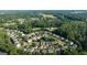 A comprehensive aerial perspective of a community nestled among trees at 4770 Shiloh Springs Rd, Cumming, GA 30040