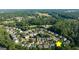 A neighborhood aerial view emphasizing community layout and tree coverage at 4770 Shiloh Springs Rd, Cumming, GA 30040