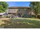 Large backyard with a covered patio and ample space for gardening and entertaining at 4770 Shiloh Springs Rd, Cumming, GA 30040