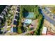 An aerial view of a neighborhood pool and tennis courts at 4770 Shiloh Springs Rd, Cumming, GA 30040