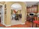 Dining room with hardwood floors, arched doorway, and decorative lighting at 4770 Shiloh Springs Rd, Cumming, GA 30040