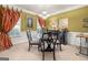 Formal dining room with a round glass table, chandelier, and elegant decor at 4770 Shiloh Springs Rd, Cumming, GA 30040