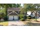 Beautiful two-story home featuring a two-car garage, manicured landscaping, and a welcoming entrance at 4770 Shiloh Springs Rd, Cumming, GA 30040