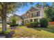 Two-story home featuring a stone facade, covered porch, and well-maintained lawn at 4770 Shiloh Springs Rd, Cumming, GA 30040