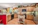 Spacious kitchen with wood floors, granite countertops, and ample cabinet space at 4770 Shiloh Springs Rd, Cumming, GA 30040