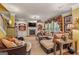 Cozy living room featuring a fireplace, built-in shelves, and large windows at 4770 Shiloh Springs Rd, Cumming, GA 30040
