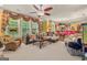 Spacious living room featuring a ceiling fan and multiple seating options at 4770 Shiloh Springs Rd, Cumming, GA 30040