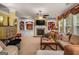 Spacious living room with fireplace, built-in bookshelves, and natural light at 4770 Shiloh Springs Rd, Cumming, GA 30040
