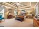 Expansive main bedroom with tray ceilings and elegant furnishings at 4770 Shiloh Springs Rd, Cumming, GA 30040