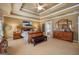 Inviting main bedroom features a tray ceiling and lots of natural light at 4770 Shiloh Springs Rd, Cumming, GA 30040
