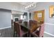 Elegant dining room featuring a large table, stylish lighting, and wood floors at 1632 Zacharys Way, Mcdonough, GA 30253