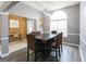 Bright dining room area with modern light fixture and large windows at 1632 Zacharys Way, Mcdonough, GA 30253