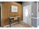 Welcoming foyer with wood accent wall, console table, and white front door at 1632 Zacharys Way, Mcdonough, GA 30253