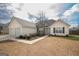 Inviting ranch-style home with a two-car garage, stone detail, and landscaped front yard at 1632 Zacharys Way, Mcdonough, GA 30253