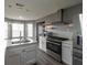 Well-lit kitchen with stainless steel appliances, bright white cabinets, and quartz countertops at 1632 Zacharys Way, Mcdonough, GA 30253