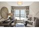 Inviting home office featuring shiplap walls, modern decor, comfortable seating, and a bright window view at 2446 Naples St, Hoschton, GA 30548