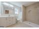A bathroom featuring a shower, modern vanity, and neutral tiling in a renovated home at 200 Adeline Nw Ave, Atlanta, GA 30314