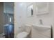 Bright half bathroom with a toilet, sink, modern faucet, and large mirror in a home at 200 Adeline Nw Ave, Atlanta, GA 30314