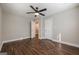 Bedroom with wood floors, a ceiling fan, and access to other parts of the house at 200 Adeline Nw Ave, Atlanta, GA 30314