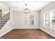 Bright dining room featuring modern chandelier, hardwood floors, and natural light at 200 Adeline Nw Ave, Atlanta, GA 30314