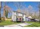 Charming two-story home with landscaped yard, black accents, and bright red front door at 200 Adeline Nw Ave, Atlanta, GA 30314