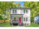 Modern two-story home with a red front door, black accents, and a landscaped yard at 200 Adeline Nw Ave, Atlanta, GA 30314
