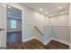 A view of the second story landing with wood flooring, overhead lighting, and neutral paint at 200 Adeline Nw Ave, Atlanta, GA 30314