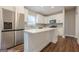 Beautiful kitchen with stainless appliances, white cabinets, island, and wood floors at 200 Adeline Nw Ave, Atlanta, GA 30314