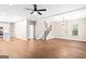 Open-concept living room with staircase, wood flooring, and view to the kitchen at 200 Adeline Nw Ave, Atlanta, GA 30314