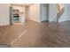 Light-filled living space with wood floors, open to kitchen and staircase at 200 Adeline Nw Ave, Atlanta, GA 30314