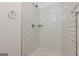 Modern shower with subway tile, new fixtures and stone floor at 200 Adeline Nw Ave, Atlanta, GA 30314