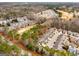 Aerial view of a residential community with golf course, showcasing the layout and surrounding greenery at 103 Augusta Dr, Peachtree City, GA 30269