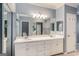 Bright bathroom with double sink vanity, framed mirrors, and elegant fixtures at 103 Augusta Dr, Peachtree City, GA 30269