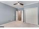 Bedroom featuring carpet flooring, ensuite bathroom, and closet with sliding doors at 103 Augusta Dr, Peachtree City, GA 30269