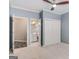 Bedroom featuring carpet flooring, ensuite bathroom, and closet with sliding doors at 103 Augusta Dr, Peachtree City, GA 30269