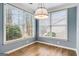 Sun-filled breakfast nook features wood floors, large windows, modern lighting, and neutral paint at 103 Augusta Dr, Peachtree City, GA 30269