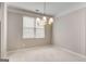 Dining room featuring contemporary chandelier and sun-filled windows at 103 Augusta Dr, Peachtree City, GA 30269