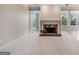 Cozy living room with marble fireplace, open floorplan, and natural light at 103 Augusta Dr, Peachtree City, GA 30269